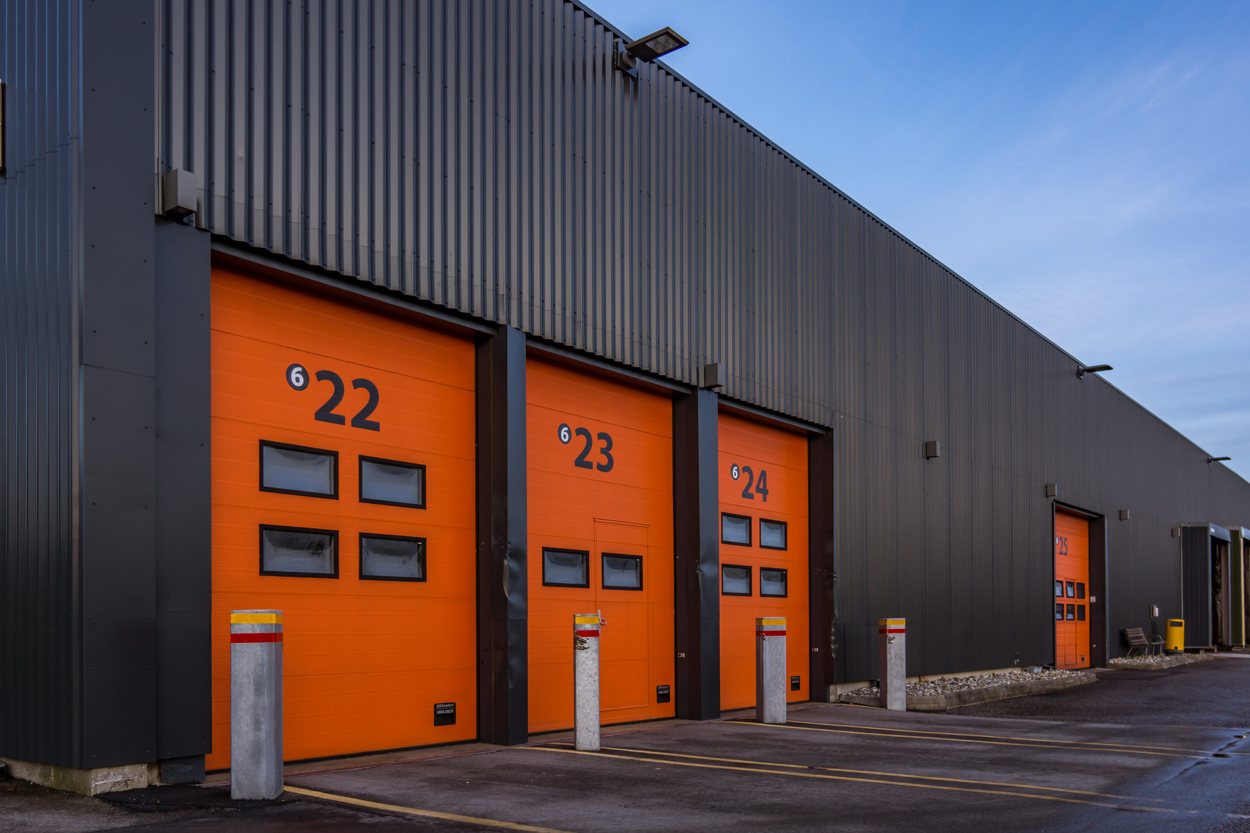 Red aluminum doors to  a black cargo building, Frederikssund, Denmark, January 2, 2018